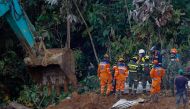 Members of the rescue team find a corpse of a victim in the area of a landslide in the road between Quibdo and Medellin, Choco department, Colombia on January 14, 2024. Photo by Fredy Builes / AFP