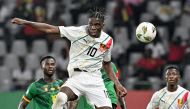 Guinea's midfielder #10 Moriba Kourouma (C) heads the ball during the Africa Cup of Nations (CAN) 2024 group C football match between Cameroon and Guinea at Stade Charles Konan Banny in Yamoussoukro on January 15, 2024. (Photo by Issouf SANOGO / AFP)
