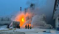 This handout photograph published on the official Telegram account of the governor of the Leningrad region Aleksandr Drozdenko on January 21, 2024, shows rescuers working to extinguish a fire at a natural gas terminal in the Russian Baltic Sea port of Ust-Luga. Photo by Handout / Telegram / @drozdenko_au_lo / AFP