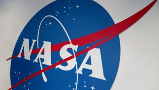 The NASA logo is displayed at the Earth Information Center exhibit, at NASA headquarters in Washington, DC, on June 21, 2023. Photo by Stefani REYNOLDS / AFP