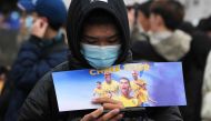 Fans of Portuguese footballer Cristiano Ronaldo gather prior to an Al-Nassr training session at the Universiade Sports Center in Shenzhen, Guangdong Province, on January 23, 2024. (Photo by Pedro PARDO / AFP)