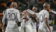 South Africa's players celebrate after winning the Africa Cup of Nations (CAN) 2024 round of 16 football match between Morocco and South Africa at the Stade Laurent Pokou in San Pedro on January 30, 2024. (Photo by SIA KAMBOU / AFP)
