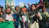 Supporters of Khan's Pakistan Tehreek-e-Insaf (PTI) party protest against the alleged skewing in Pakistan's national election results, in Karachi on February 11, 2024. (Photo by Asif Hassan / AFP)
