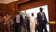 Chad transitional president General Mahamat Idriss Deby greets supporters as he arrives at the Chadian Ministry of Foreign Affairs ahead of the start of an inauguration meeting of a coalition of parties for his candidacy for the presidential election of May 6 in N'Djamena on March 2, 2024. (Photo by AFP)
