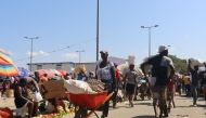 Haitian citizens take part in the Dajabon border market at the Dominican Republic-Haiti border, as seen from Dajabon, Dominican Republic on March 8, 2024. (Photo by Erickson Polanco / AFP)