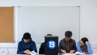 Polling supervisors check lists at a polling station in Parque das Nacoes, Lisbon, during the legislative elections held on March 10, 2024 in Portugal. (Photo by ANDRE DIAS NOBRE / AFP)

