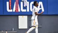 Real Madrid's Brazilian forward #07 Vinicius Junior celebrates scoring the opening goal with Real Madrid's Brazilian forward #11 Rodrygo during the Spanish league football match between CA Osasuna and Real Madrid CF at El Sadar stadium in Pamplona on March 16, 2024. (Photo by Ander Gillenea / AFP)
