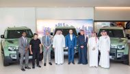 QNB and Visa officials pose for group photo with the winners of the winter campaign.
