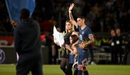(FILES) Paris Saint-Germain's Argentinian midfielder Angel Di Maria, his wife and children, stand on the pitch during a farewell ceremony after he played his last game for the club after the French L1 football match between Paris Saint-Germain (PSG) and Metz at the Parc des Princes stadium in Paris on May 21, 2022. (Photo by Anne-Christine POUJOULAT / AFP)
