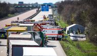 Emergency vehicles and rescue helicopters stand on the A9 highway at the scene of an accident where several persons were killed on March 27, 2024 in Schkeuditz, near Leipzig, eastern Germany. (Photo by Jan Woitas / dpa / AFP) / Germany OUT