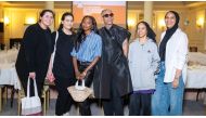 Qatar-based fashion designers pose for a photograph.