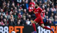 Liverpool's Egyptian striker #11 Mohamed Salah controls the ball during the English Premier League football match between Liverpool and Brighton and Hove Albion at Anfield in Liverpool, north west England on March 31, 2024. Photo by Paul ELLIS / AFP.