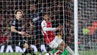 Luton Town's Japanese defender #27 Daiki Hashioka (L) reacts after scoring an owngoal during the English Premier League football match between Arsenal and Luton Town at the Emirates Stadium in London on April 3, 2024. (Photo by Adrian DENNIS / AFP)