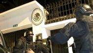 Ecuadorian police special forces attempt to enter the Mexican embassy in Quito to arrest Ecuador's former Vice President Jorge Glas, on April 5, 2024. Photo by ALBERTO SUAREZ / AFP.