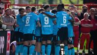 Bayer Leverkusen's players celebrate during the German first division Bundesliga football match between 1 FC Union Berlin and Bayer 04 Leverkusen in Berlin, Germany on April 6, 2024. (Photo by Tobias SCHWARZ / AFP)