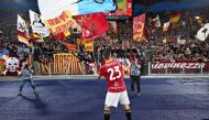 Roma's Italian defender #23 Gianluca Mancini celebrates with fans after winning the Italian Serie A football match between AS Roma and Lazio on April 6, 2024 at the Olympic stadium in Rome. (Photo by Alberto PIZZOLI / AFP)

