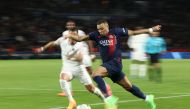 Paris Saint-Germain's French forward #07 Kylian Mbappe runs with the ball during the French L1 football match between Paris Saint-Germain (PSG) and Clermont Foot 63 at the Parc des Princes stadium in Paris on April 6, 2024. (Photo by FRANCK FIFE / AFP)
