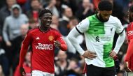 Manchester United's English midfielder #37 Kobbie Mainoo (L) celebrates after scoring their second goal during the English Premier League football match between Manchester United and Liverpool at Old Trafford in Manchester, north west England, on April 7, 2024. (Photo by Paul ELLIS / AFP)