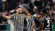 Juventus' Italian defender #04 Federico Gatti celebrates with teammates after winning 1-0 the Italian Serie A football match between Juventus and Fiorentina, at The Allianz Stadium, in Turin on April 7, 2024. (Photo by Marco BERTORELLO / AFP)
