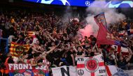 Barcelona's supporters cheer their team on from the stands during the UEFA Champions League quarter final first leg football match between Paris Saint-Germain (PSG) and FC Barcelona at the Parc des Princes stadium in Paris on April 10, 2024. (Photo by Miguel Medina / AFP)
