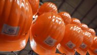 (FILES) Hard hats of employees are pictured at the hot strip production at the Thyssenkrupp Steel Europe in Duisburg, western Germany on May 2, 2023. (Photo by Ina FASSBENDER / AFP)
