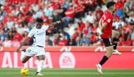 Real Madrid's French midfielder #18 Aurelien Tchouameni shots to score his team's first goal during the Spanish league football match between RCD Mallorca and Real Madrid CF at the Mallorca Son Moix stadium in Palma de Mallorca on April 13, 2024. (Photo by JAIME REINA / AFP)
