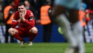 Liverpool's Scottish defender #26 Andrew Robertson reacts to their defeat on the pitch after the English Premier League football match between Liverpool and Crystal Palace at Anfield in Liverpool, north west England on April 14, 2024. Palace won the game 1-0. (Photo by Paul ELLIS / AFP)