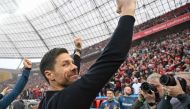 Bayer Leverkusen's Spanish head coach Xabi Alonso celebrates after the German first division Bundesliga football match Bayer 04 Leverkusen v Werder Bremen in Leverkusen, western Germany, on April 14, 2024. (Photo by INA FASSBENDER / AFP)