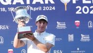 England's Calum Fitzgerald poses with the Qatar Open trophy.