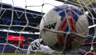 Manchester United's Danish striker #11 Rasmus Hojlund (L) scores the winning penalty in the shoot-out during the English FA Cup semi-final football match between Coventry City and Manchester United at Wembley Stadium in north west London on April 21, 2024. (Photo by Glyn KIRK / AFP) 

