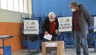 An elederly woman casts her vote at a polling station during a referendum on tougher measures against organized crime in Quito on April 21, 2024. (Photo by Rodrigo Buendia / AFP)