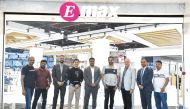 Shumalan Naicker, Territory Head of Landmark Group and Yacoub Boutros, Managing Director, Tawar Mall, with E-Max and Tawar Mall team.