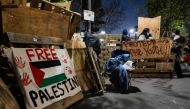 Pro-Palestinian students and activists protest at an encampment in the campus of the University of California, Los Angeles (UCLA) in Los Angeles, California, on May 6, 2024. Photo by Etienne LAURENT / AFP.