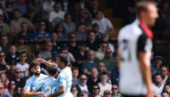 Manchester City's Croatian defender #24 Josko Gvardiol (L) celebrates scoring the team's first goal during the English Premier League football match between Fulham and Manchester City at Craven Cottage in London on May 11, 2024. (Photo by Adrian DENNIS / AFP)