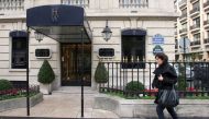(Files) A woman walks in front of the ultra-luxury jewellery house Harry Winston on December 5, 2008, in Paris. (Photo by Patrick Kovarik / AFP)