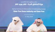 Abdulla Hamad Al Binali, Director of Investor Relations & Technical Support at QFZ, and Hamad Al Fahida, Chief Operating Officer of Qatar Post during the MoU signing.