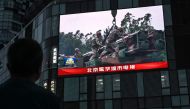 An outdoor screen shows a news coverage of China military drills around Taiwan, in Beijing on May 23, 2024. Photo by Jade Gao / AFP.