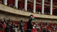French leftist La France Insoumise (LFI) party member of parliament Sebastien Delogu waves a Palestinian national flag during a session of questions to the government at the National Assembly in Paris on May 28, 2024. Photo by Miguel MEDINA / AFP.
 
