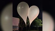 This handout photo taken by the South Korean Defence Ministry between the night of May 28 and 29, 2024 and released on May 29 shows unidentified objects believed to be North Korean propaganda material attached to balloons on a street in Chungnam Province. (Photo by Handout / South Korean Defence Ministry / AFP) 