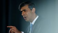 Britain's Prime Minister and Conservative Party leader Rishi Sunak delivers a speech to launch the Conservatives' general election manifesto in Silverstone, central England, on June 11, 2024, in the build-up to the UK general election on July 4. (Photo by BENJAMIN CREMEL / POOL / AFP)