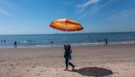 People try to cool off at Coney Island on a sweltering afternoon on the first day of summer on June 20, 2024 in New York City. (Photo by Spencer Platt/Getty Images via AFP)

