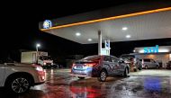 Car line up at a gas station before hurricane Beryl lands in Bridgetown, Barbados on June 29, 2024. (Photo by Chandan Khanna / AFP)