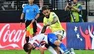 Brazil's midfielder 18 Douglas Luiz fights for the ball with Paraguay's midfielder 14 Andres Cubas during the Conmebol 2024 Copa America tournament group D football match between Paraguay and Brazil at Allegiant Stadium in Las Vegas, Nevada on June 28, 2024. (Photo by Frederic J. Brown / AFP)