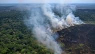 (Files) Aerial view of a burnt area in the Amazon rainforest, near the Lago do Cunia Extractive Reserve, on the border of the states of Rondonia and Amazonas, on August 31, 2022. (Photo by Douglas Magno / AFP)