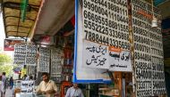 Shopkeepers sell sim cards at a mobile market in Islamabad on July 4, 2024.  (Photo by Farooq Naeem / AFP)