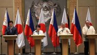 Philippines' Secretary of Foreign Affairs Enrique Manalo (2nd R) gestures as he answers a question while Japan's Defence Minister Minoru Kihara (L), Japan's Foreign Minister Yoko Kamikawa (2nd L) and Philippines' Secretary of Defence Gilberto Teodoro (R) listens during a joint press conference after their 2+2 meeting in Manila on July 8, 2024. (Photo by Ted Aljibe / AFP)