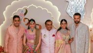 Billionaire tycoon and Chairman of Reliance Industries Mukesh Ambani (centre), daughter Isha Ambani (2R), son Akash Ambani (L), daughter-in-law Shloka Mehta (2L), and son-in-law Anand Piramal pose for photos as they arrive to attend the wedding ceremony of Anant Ambani and Radhika Merchant in Mumbai on July 12, 2024. (Photo by Punit Paranjpe / AFP)