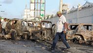 A man looks at the debris and destruction at a cafe in Mogadishu on July 15, 2024 following a car bomb blast on July 14, 2024. (Photo by Hassan Ali Elmi / AFP)
 