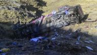 This picture released by the Peruvian National Police shows a bus that plunged down a ravine on a remote site in the Andes, Peru, on July 16, 2024. (Photo by Handout / Peruvian National Police / AFP)
