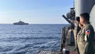 The USS Gabrielle Giffords receives passing honours by Philippine Navy Officers aboard BRP Gregorio Del Pilar during the 3rd AFP-USINDOPACOM Maritime Cooperative Activity in the disputed South China Sea. (Photo by Handout / Armed Forces of the Philippines' Western Command / AFP)

